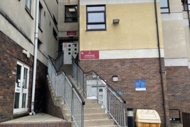 Craig Mair entry stairs, with the door to the accessible lift just visible behind the railings.